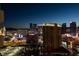 A stunning night view shows the illuminated cityscape from a high vantage point at 135 E Harmon Ave # 2821, Las Vegas, NV 89109