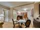 Dining area featuring a table, chairs, and partial view of the bathroom and kitchen at 135 E Harmon Ave # 2821, Las Vegas, NV 89109
