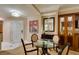 Comfortable dining area features a glass table, four chairs, and modern décor at 135 E Harmon Ave # 2821, Las Vegas, NV 89109