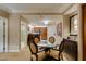 Dining area with table, chairs, and partial view of the bathroom and kitchen area at 135 E Harmon Ave # 2821, Las Vegas, NV 89109
