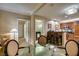 Dining area with a table, chairs, and view of the kitchen and bathroom at 135 E Harmon Ave # 2821, Las Vegas, NV 89109