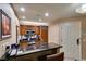 Modern kitchen with wooden cabinets, stainless steel appliances, and granite countertops at 135 E Harmon Ave # 2821, Las Vegas, NV 89109