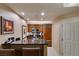 Modern kitchen with wooden cabinets, stainless steel appliances, and granite countertops at 135 E Harmon Ave # 2821, Las Vegas, NV 89109