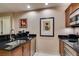 Modern kitchen featuring stainless steel appliances and dark granite countertops at 135 E Harmon Ave # 2821, Las Vegas, NV 89109