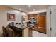 Modern kitchen with wooden cabinets, stainless steel appliances, and granite countertops at 135 E Harmon Ave # 2821, Las Vegas, NV 89109