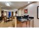 Kitchenette with a breakfast bar that opens to a seating area and a view at 135 E Harmon Ave # 2821, Las Vegas, NV 89109