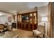 Comfortable living area with a wooden cabinet, TV, table, and chair at 135 E Harmon Ave # 2821, Las Vegas, NV 89109