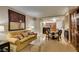 Open-concept living room featuring comfortable seating area, dining table, and partial kitchen view at 135 E Harmon Ave # 2821, Las Vegas, NV 89109