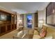 Inviting living area with comfortable seating and balcony access with city views at 135 E Harmon Ave # 2821, Las Vegas, NV 89109