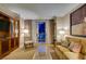 Inviting living area with comfortable seating and balcony access with city views at 135 E Harmon Ave # 2821, Las Vegas, NV 89109