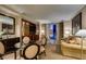 Inviting living area with a glass table, comfortable seating, and a beautiful view at 135 E Harmon Ave # 2821, Las Vegas, NV 89109