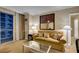 Cozy living room featuring a comfortable couch, glass table, and balcony with city views at 135 E Harmon Ave # 2821, Las Vegas, NV 89109