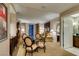 Inviting living area with a glass table, comfortable seating, and access to the balcony at 135 E Harmon Ave # 2821, Las Vegas, NV 89109