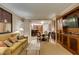 Open-concept living room featuring a comfortable seating area, dining table, and kitchen at 135 E Harmon Ave # 2821, Las Vegas, NV 89109
