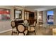 Inviting living area with a glass table, comfortable seating, and balcony access at 135 E Harmon Ave # 2821, Las Vegas, NV 89109