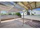 Covered backyard patio area with concrete and brick accents, perfect for outdoor relaxation at 1950 Turtlerock St, Las Vegas, NV 89142