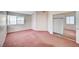 Large bedroom features carpet flooring, a window, and a mirrored closet at 1950 Turtlerock St, Las Vegas, NV 89142
