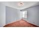 Cozy bedroom with neutral walls, carpet flooring, and a window allowing natural light at 1950 Turtlerock St, Las Vegas, NV 89142