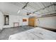 Garage featuring storage cabinets, water heater, workbench, and overhead lighting, ready for parking and projects at 1950 Turtlerock St, Las Vegas, NV 89142