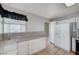 Well-lit kitchen featuring tile countertops, ample cabinet space, and essential appliances at 1950 Turtlerock St, Las Vegas, NV 89142