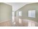 Spacious living room features neutral paint, vaulted ceilings, tile floors and lots of windows for natural light at 1950 Turtlerock St, Las Vegas, NV 89142