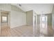Bright and airy living room features neutral paint, vaulted ceilings, tile floors and lots of windows for natural light at 1950 Turtlerock St, Las Vegas, NV 89142