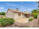 The backyard boasts a covered patio, rock landscaping, a desert garden, and a stucco exterior at 1981 Spring Lake Dr, Henderson, NV 89002