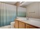 Bathroom featuring a vanity with a white countertop, a large mirror, and a shower with a tub at 1981 Spring Lake Dr, Henderson, NV 89002
