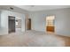 Large bedroom featuring carpet, closet, and access to another room and bathroom at 1981 Spring Lake Dr, Henderson, NV 89002