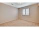 Bedroom with carpet flooring, neutral walls and shuttered window at 1981 Spring Lake Dr, Henderson, NV 89002