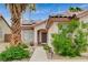 Charming single-story house with desert landscaping, solar panels, and a walkway leading to the front door at 1981 Spring Lake Dr, Henderson, NV 89002