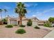 Single-story home featuring desert landscaping, a two-car garage, a driveway with parking, and solar panels at 1981 Spring Lake Dr, Henderson, NV 89002