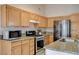 Updated kitchen features stainless steel appliances, granite countertops and lots of storage space at 1981 Spring Lake Dr, Henderson, NV 89002
