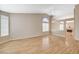 Spacious living room with hardwood floors, neutral paint, a ceiling fan, and natural light at 1981 Spring Lake Dr, Henderson, NV 89002