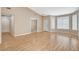 Open living room with hardwood floors, neutral walls, and access to other living areas at 1981 Spring Lake Dr, Henderson, NV 89002