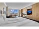 Bright bedroom with a king-size bed, sitting area, kitchenette, and expansive city views at 2000 Fashion Show Dr # 2400, Las Vegas, NV 89109