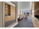 Bedroom featuring a king-size bed, built-in cabinets, and large windows with a cityscape view at 2000 Fashion Show Dr # 2400, Las Vegas, NV 89109