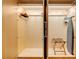 Spacious closet with built-in organizers, hanging rods, luggage rack, and ironing board at 2000 Fashion Show Dr # 2400, Las Vegas, NV 89109