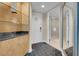 Inviting entryway with custom built-ins, stone countertop, and tile flooring at 2000 Fashion Show Dr # 2400, Las Vegas, NV 89109