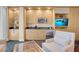 Modern kitchenette features a microwave, sink, refrigerator, cabinets, and comfortable seating at 2000 Fashion Show Dr # 2400, Las Vegas, NV 89109