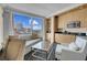 Cozy kitchenette features a sink, microwave, refrigerator, and sitting area with expansive city views at 2000 Fashion Show Dr # 2400, Las Vegas, NV 89109