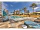 Luxurious pool area with cabanas, palm trees, and city views in Las Vegas at 2000 Fashion Show Dr # 2400, Las Vegas, NV 89109
