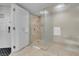 Luxurious walk-in shower with marble tile and glass door at 2000 Fashion Show Dr # 2400, Las Vegas, NV 89109