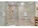 Luxurious walk-in shower with marble tile and glass door at 2000 Fashion Show Dr # 2400, Las Vegas, NV 89109