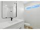Bright bathroom with a sleek black faucet, modern finishes, and a well-lit interior at 2105 Madagascar Ln, Las Vegas, NV 89117