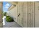 Gated entrance with lush green shrubs offering curb appeal at 2105 Madagascar Ln, Las Vegas, NV 89117