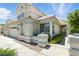 Well-maintained two-story home with manicured landscaping and a three-car garage at 2105 Madagascar Ln, Las Vegas, NV 89117
