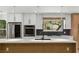 Upgraded kitchen with center island, new countertops, and stainless steel appliances at 2105 Madagascar Ln, Las Vegas, NV 89117