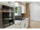 Modern kitchen design with stainless steel oven, cooktop, and white cabinetry at 2105 Madagascar Ln, Las Vegas, NV 89117
