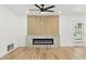 Bright living room features a fireplace and wood-look flooring at 2105 Madagascar Ln, Las Vegas, NV 89117